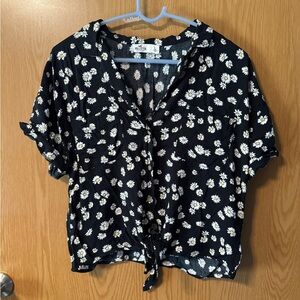 Hollister Women's Black and daisy print button down top under sweater